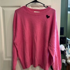 Elegant Pink Sweater with Black Heart Detail